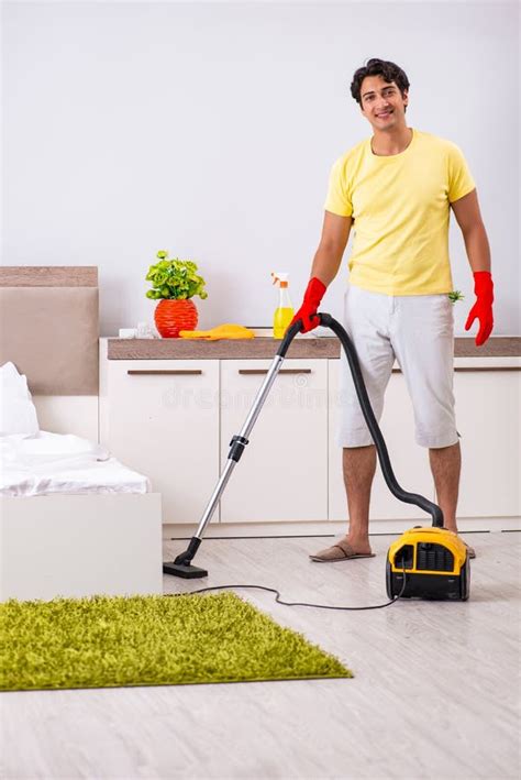 The Young Handsome Man Cleaning In The Bedroom Stock Image Image Of