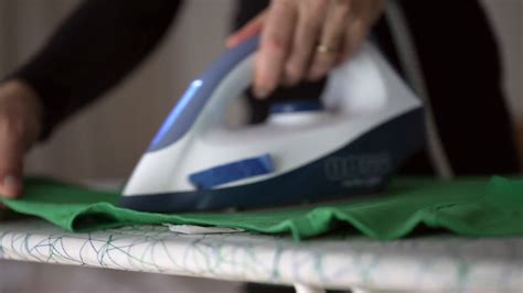 Close Up Of Womans Hand Holding Steam Iron Stock Footage SBV 348804379