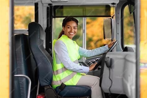 premium photo happy black female driver sitting  bus