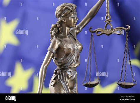 Symbol image: Justitia in front of a Europe flag Stock Photo - Alamy