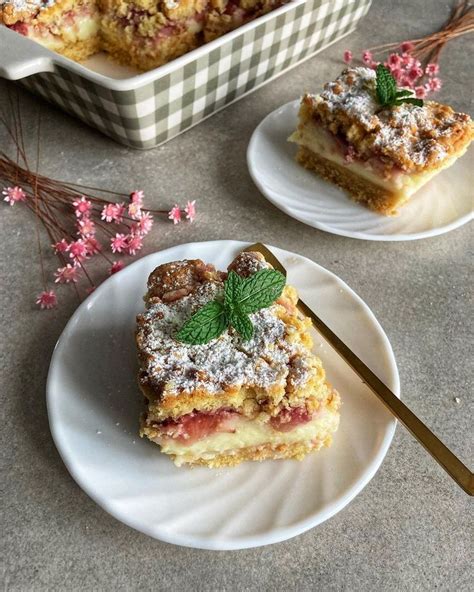 Two White Plates With Desserts On Them Next To A Baking Dish And Utensils