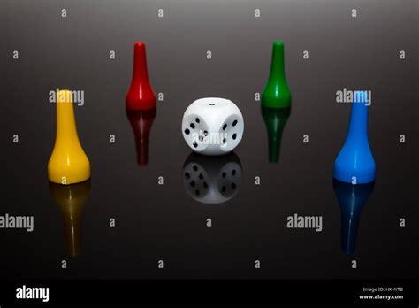 Rolling red dice over black grey background Stock Photo - Alamy