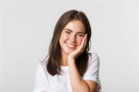 Premium Photo Close Up Of Beautiful Smiling Brunette Girl Touching