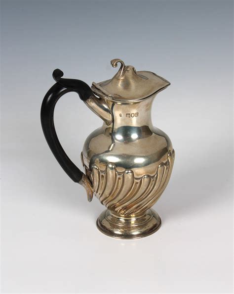 Lot An Edwardian Silver Hot Water Jug