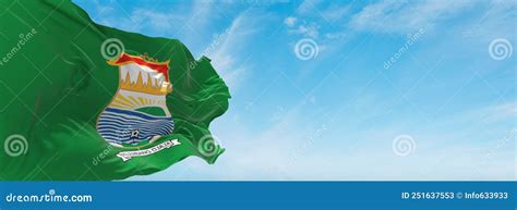 Official Flag Of Palembang City Indonesia At Cloudy Sky Background On