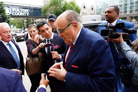 Judge sets trial date to decide how much Giuliani owes 2 election ...