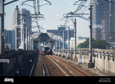 A Tsukuba Express train is stopped at Kashiwa Tanaka Station in Kashiwa ...