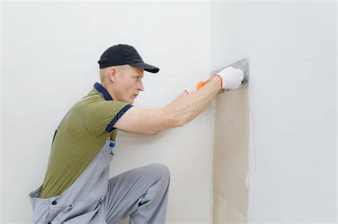 A Worker Is Plastering A Wall Stock Photo Image Of Cement Stucco