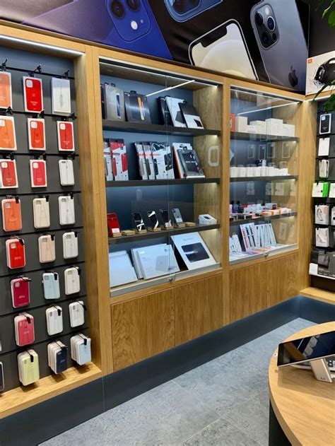 An Apple Store Display Case Filled With Different Types Of Phones And