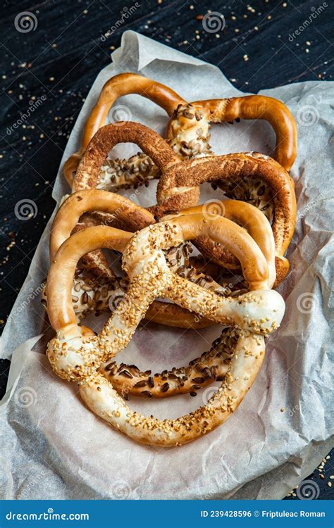 Different Types Of Baked Pretzels With Seeds On A Black Background