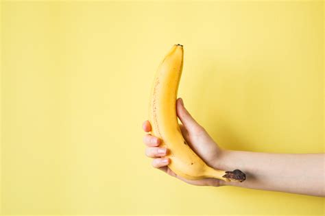 Human Hand Holding Banana Fruit Nutrition Concept Stock Photo