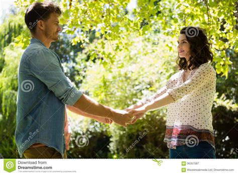 Romantic Couple Holding Hands In Garden Stock Image Image Of Happy