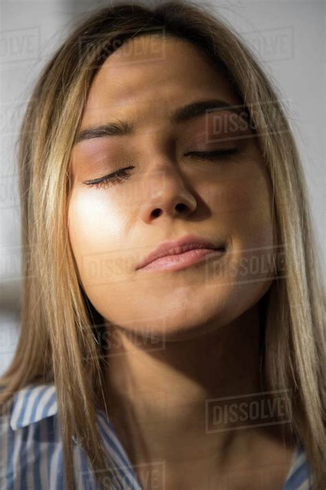 Portrait Of Young Woman With Closed Eyes Stock Photo Dissolve