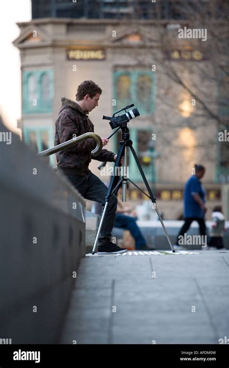 A young man filming a documentary Stock Photo - Alamy