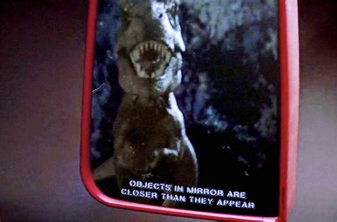 In Jurassic Park 1993 The Driver Side Mirror Of The Jeep Driven By Muldoon Has The Words