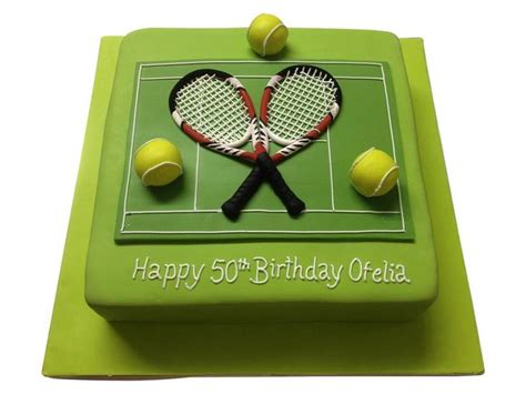 A Birthday Cake With Tennis Rackets And Balls On It