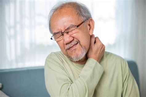 Premium Photo Old Man Suffering From Nape Neck Pain At Home