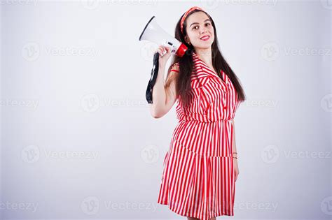 Portrait Of A Young Beautiful Woman In Red Dress Talking Into Megaphone