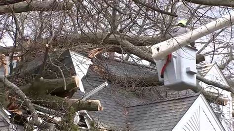 New Jersey storm damage: residents clean up downed trees, facade ...