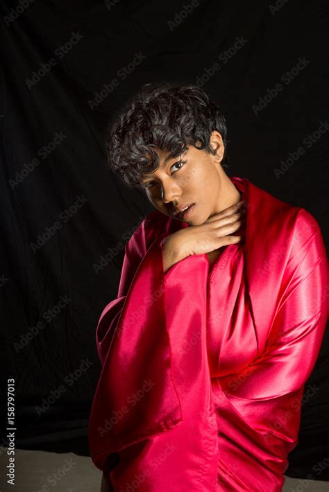 Studio Shot Of African American Woman Implied Nude With A Red Satin