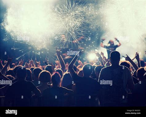 Cheering crowd at concert Stock Photo - Alamy