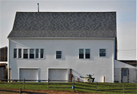 Edco Stone Blend Metal Slate Roof Installed On Barn Style Home In