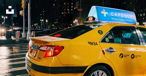 Yellow taxi cab on pedestrian lane during night time photo – Free Taxi ...