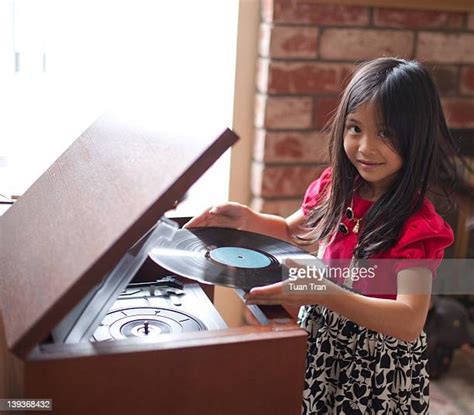 Girl Holding Vinyl Record Photos And Premium High Res Pictures Getty