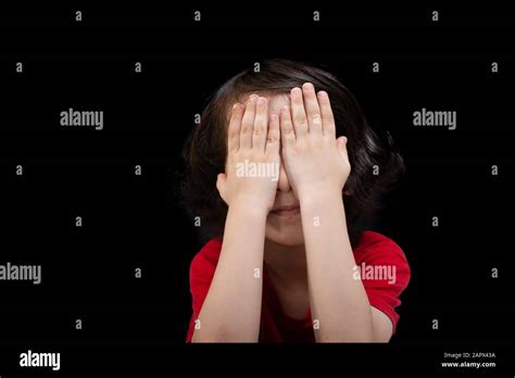 View Of Thoughtful Cute Little Boy Covering His Eyes With His Hand