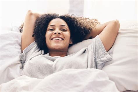 Premium Photo Black Woman Wake Up And Portrait In Home Bedroom After