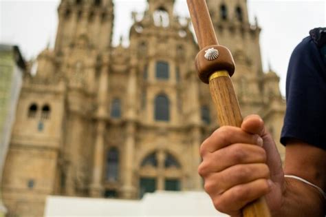 Premium Photo Midsection Of Man Holding Cross Outside Temple Against