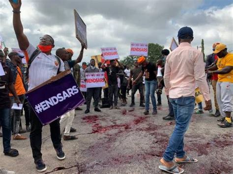 Omg See Photos Of Protesters Besiege Police Headquarters In Abuja