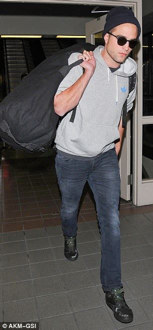 Beanie Sporting Robert Pattinson Flies Into Lax Lugging A Large Duffel