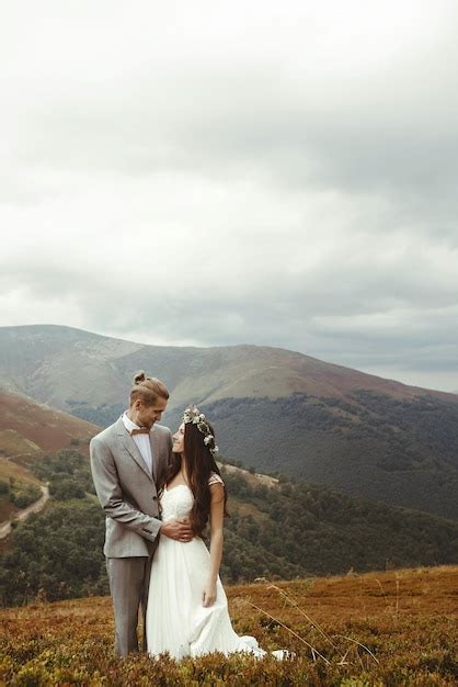 Premium Photo Gorgeous Bride And Stylish Groom Posing Hugging Boho