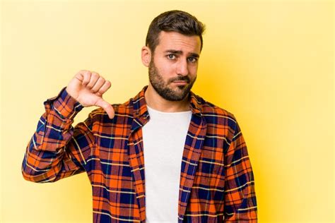 Premium Photo Young Caucasian Man Isolated On Yellow Background