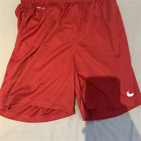 Red nike sports shorts kids xl - Depop