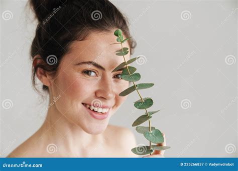 Half Naked Brunette Woman Smiling While Posing With Eucalyptus Stock