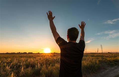 Premium Photo Man Enjoy Life With Raised Hands Against The Sky