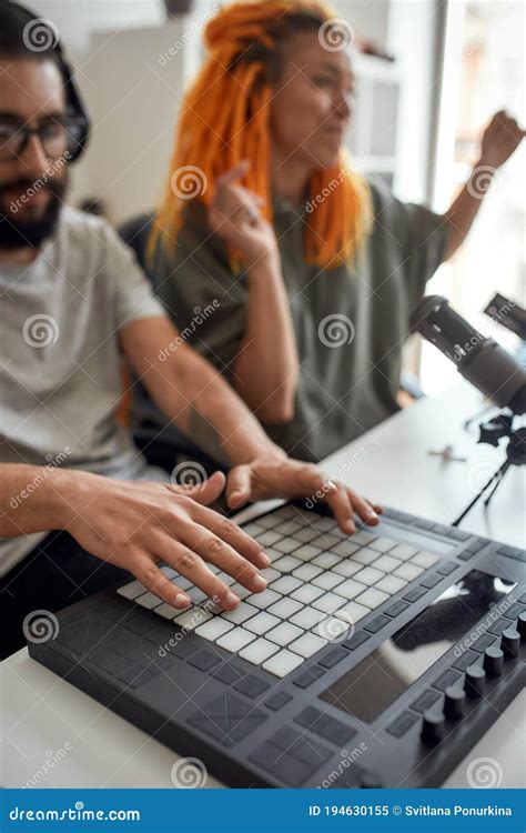 Focus On Hands Of Man Making Music Using Equipment Drum Pad Machine