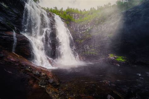 Beautiful View Of A Waterfall Flowing Over The Rocks Stock Image