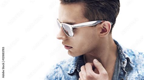 Young handsome man wearing stylish sunglasses Stock Photo | Adobe Stock