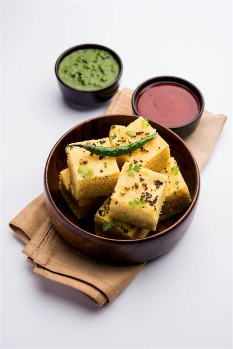 Gujarati Khaman Dhokla Or Steamed Gram Flour Puffy Snack Cake Stock