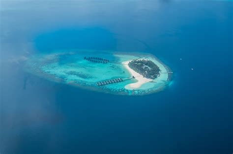 Premium Photo | Tropical islands and atolls in maldives from aerial view.