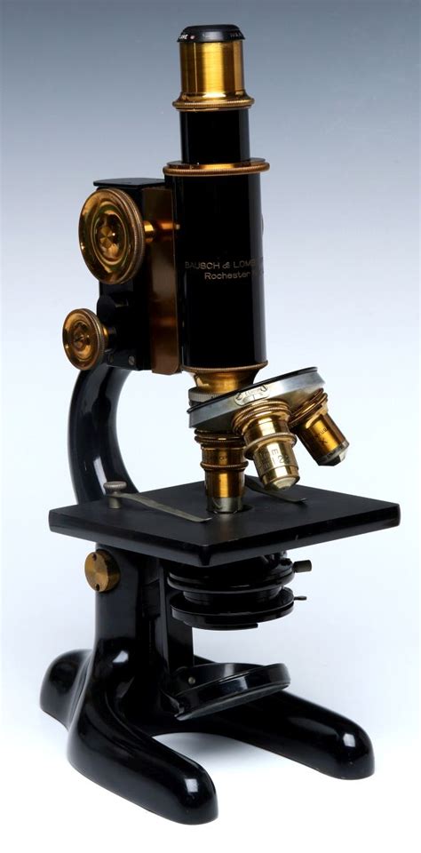 #108: A BAUSCH AND LOMB HORSE SHOE BASE MICROSCOPE