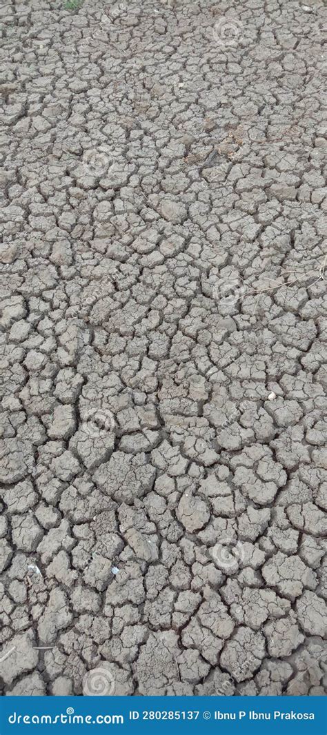 A Powerful Photograph Of Drought Stricken Soil Displaying Prominent