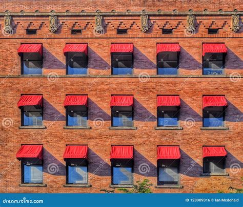 Red Awnings On A Art Deco Brick Building Editorial Photo Image Of