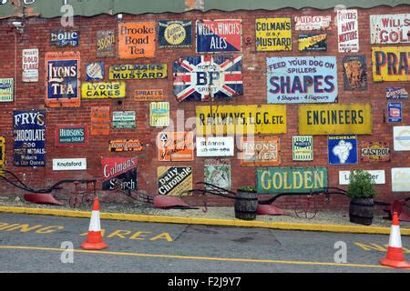 Vintage enamel advertising signs at Bygone Times antiques centre Stock ...