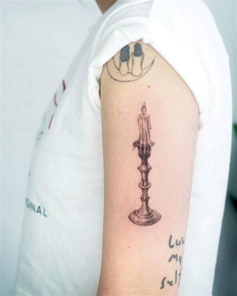 Micro Realistic Style Candle Tattoo Located On The