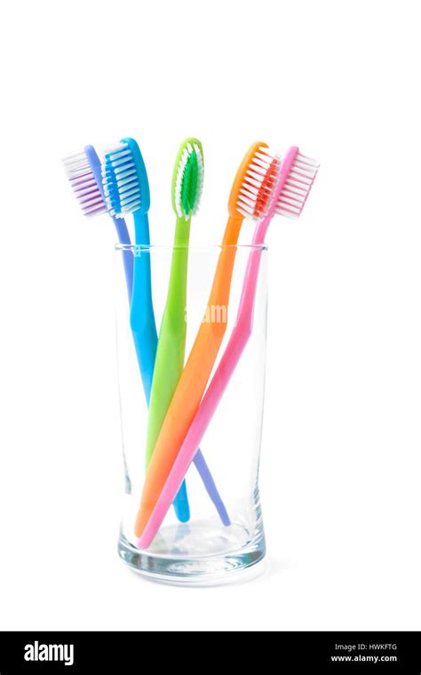 Colorful Toothbrushes In Glass Stock Photo Alamy