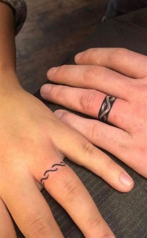 100 Unique Wedding Ring Tattoos Youll Need To See Tattoo Me Now Ring Tattoo Designs Ring